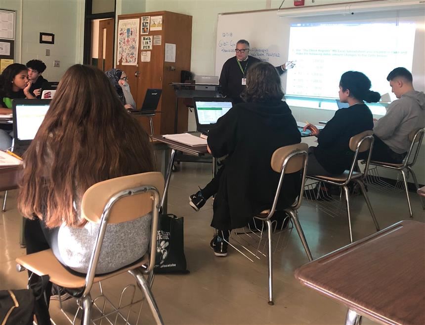 Mr. Ottino teaching Financial Literacy; photo credit:  Rae Allex 